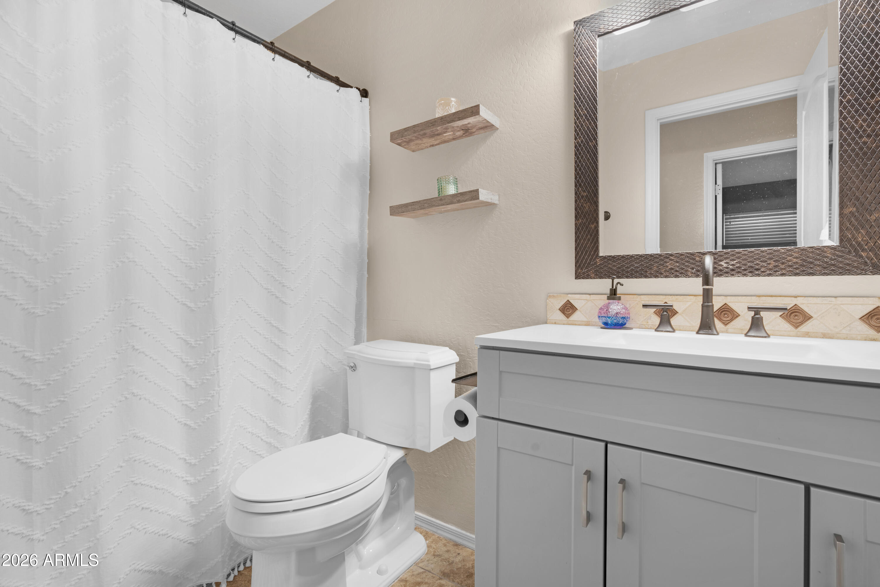 1513 West Shellfish Drive Gilbert, AZ 85233 - Photo 29 of 35 a bathroom with a sink and a toilet