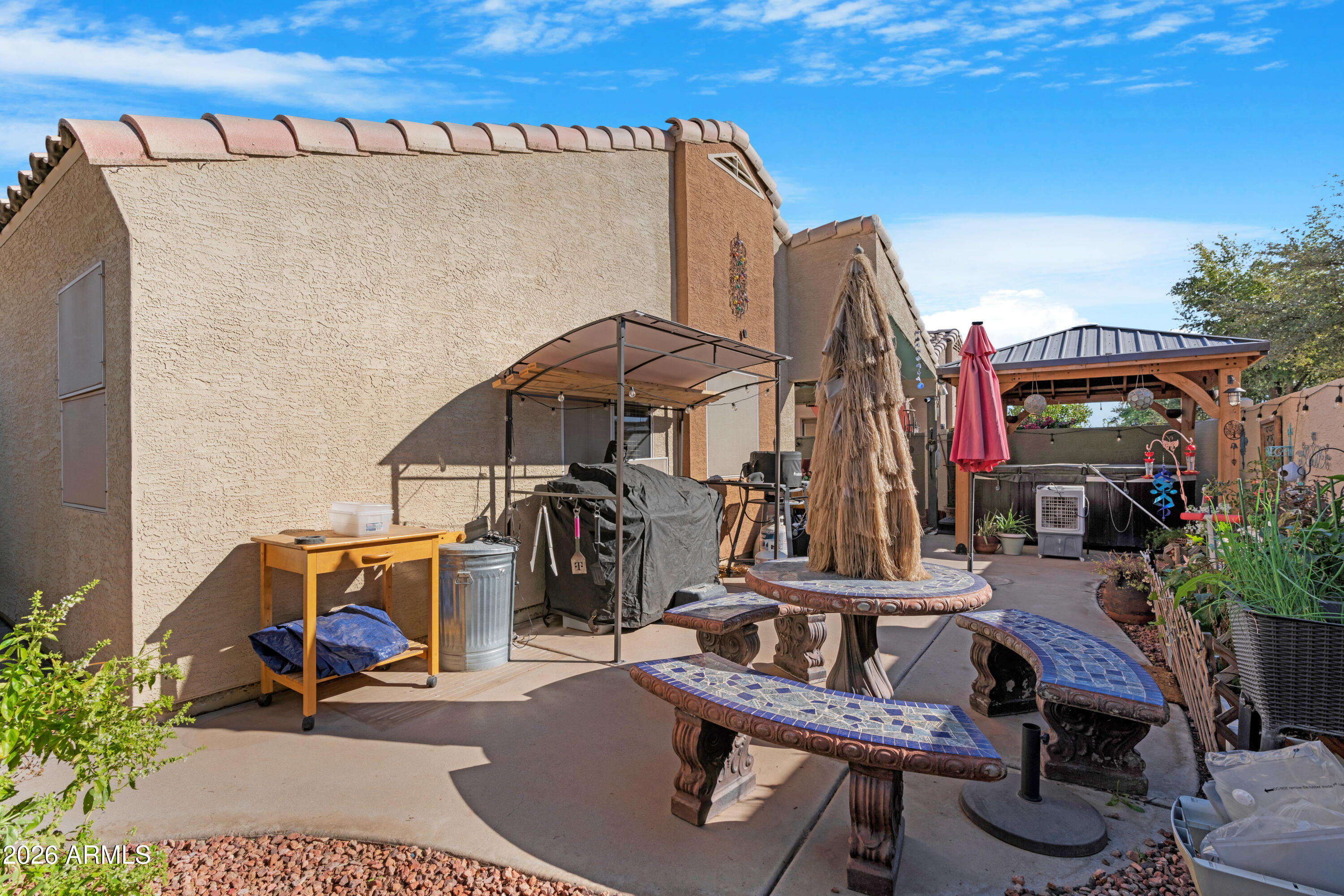 1513 West Shellfish Drive Gilbert, AZ 85233 - Photo 31 of 35 a view of a chairs and tables in patio