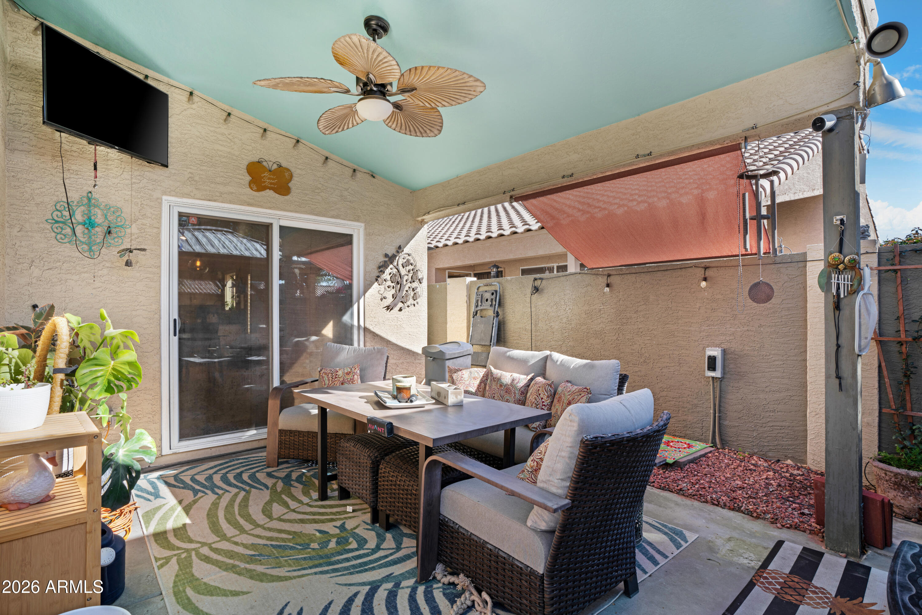 1513 West Shellfish Drive Gilbert, AZ 85233 - Photo 32 of 35 a living room with furniture a flat screen tv and a table