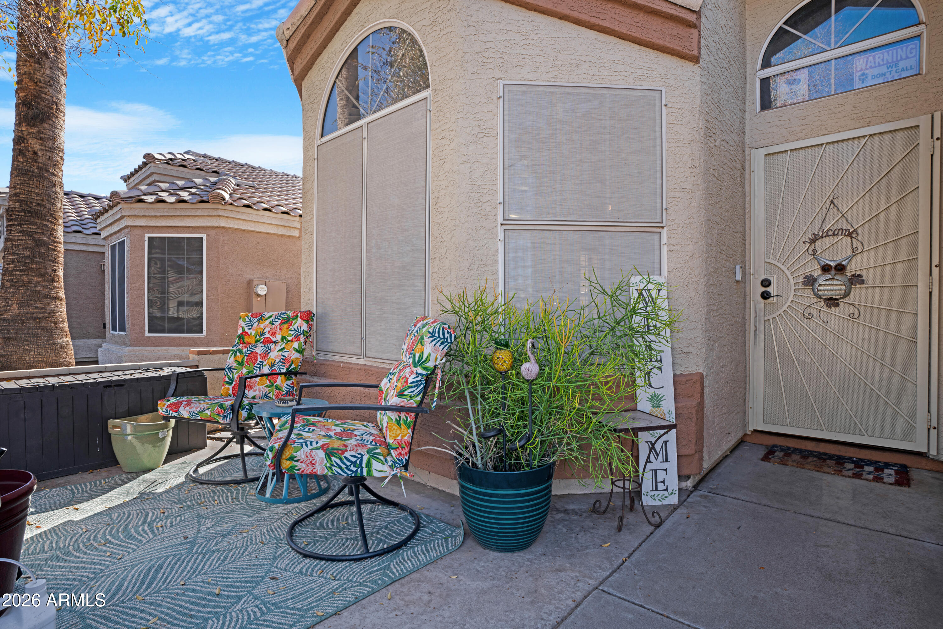 1513 West Shellfish Drive Gilbert, AZ 85233 - Photo 4 of 35 a view of two chairs in a patio