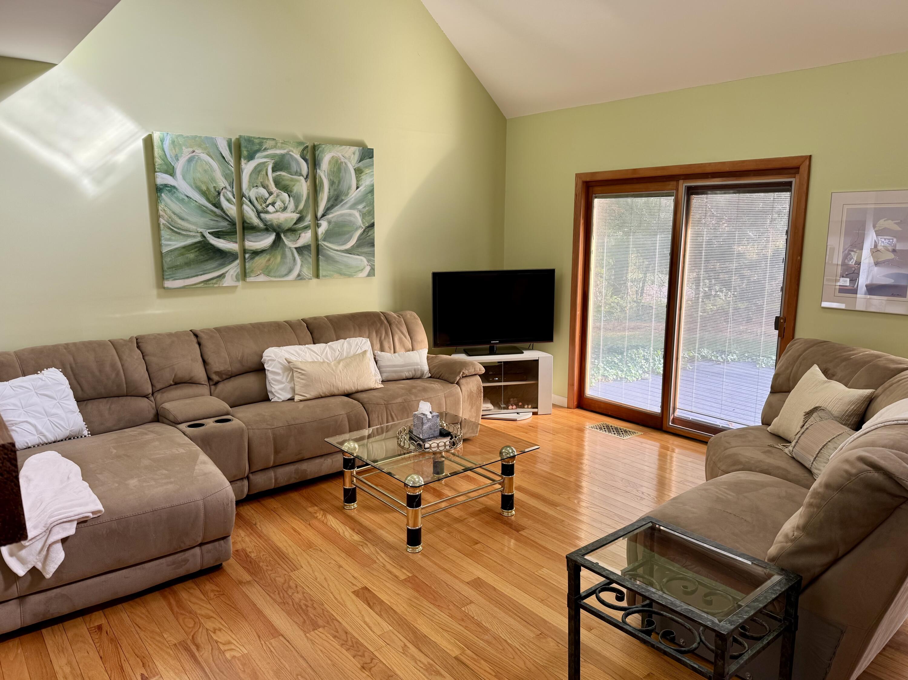 25 Twin Rocks Drive Eastham, MA 02642 - Photo 14 of 61 a living room with furniture and a flat screen tv
