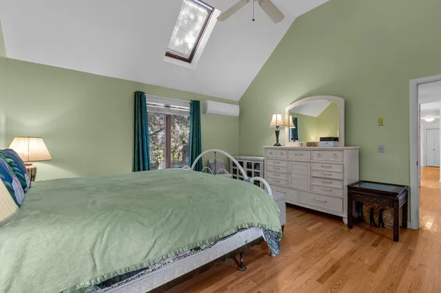 a bedroom with a bed and window