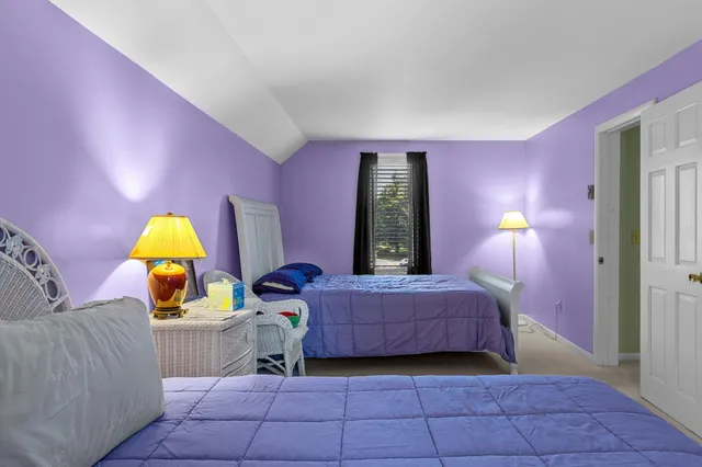 a view of a yard with wooden fence