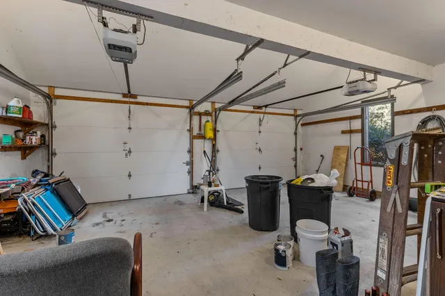 a view of a backyard with wooden floor and fence