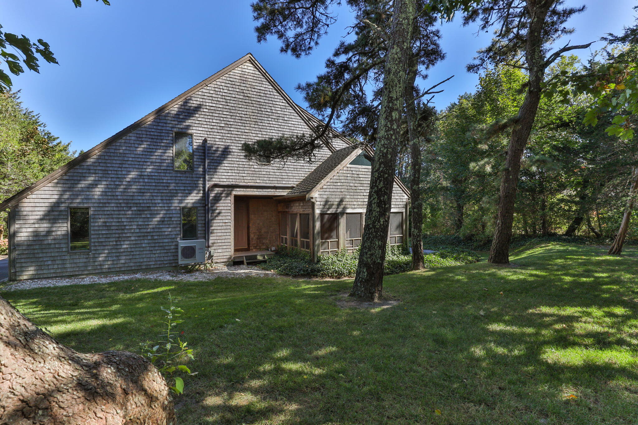 25 Twin Rocks Drive Eastham, MA 02642 - Photo 49 of 61 a front view of a house with a garden