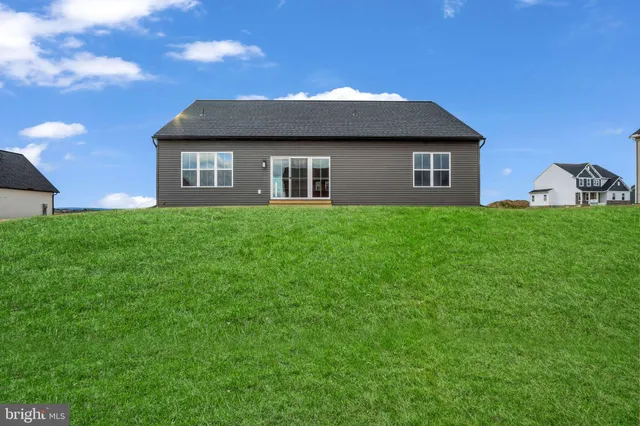 a front view of a house with yard
