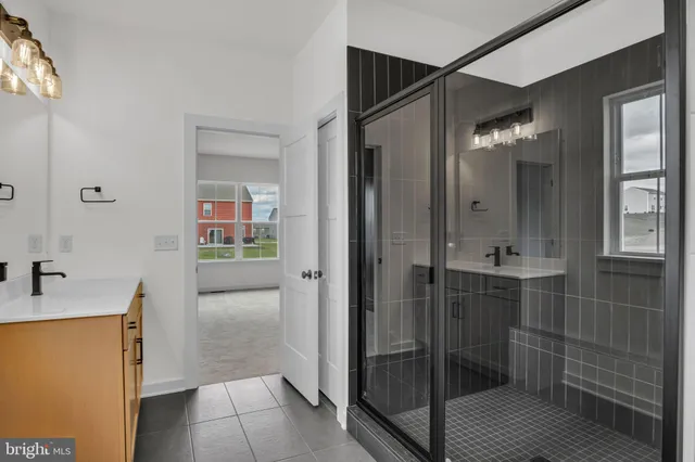 a bathroom with a shower and a sink