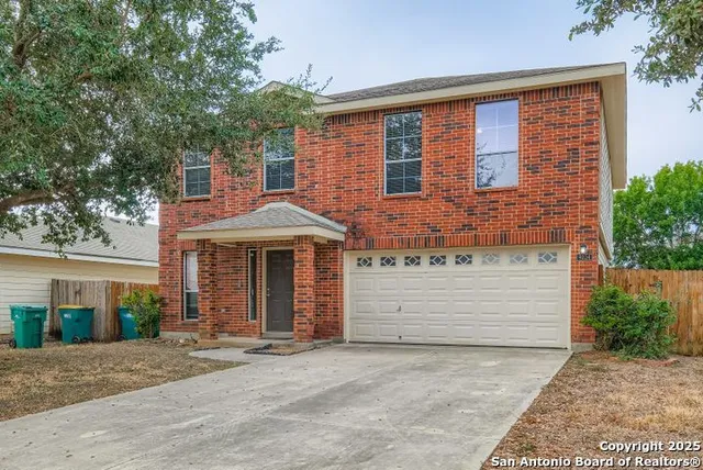 front view of a house with a garden