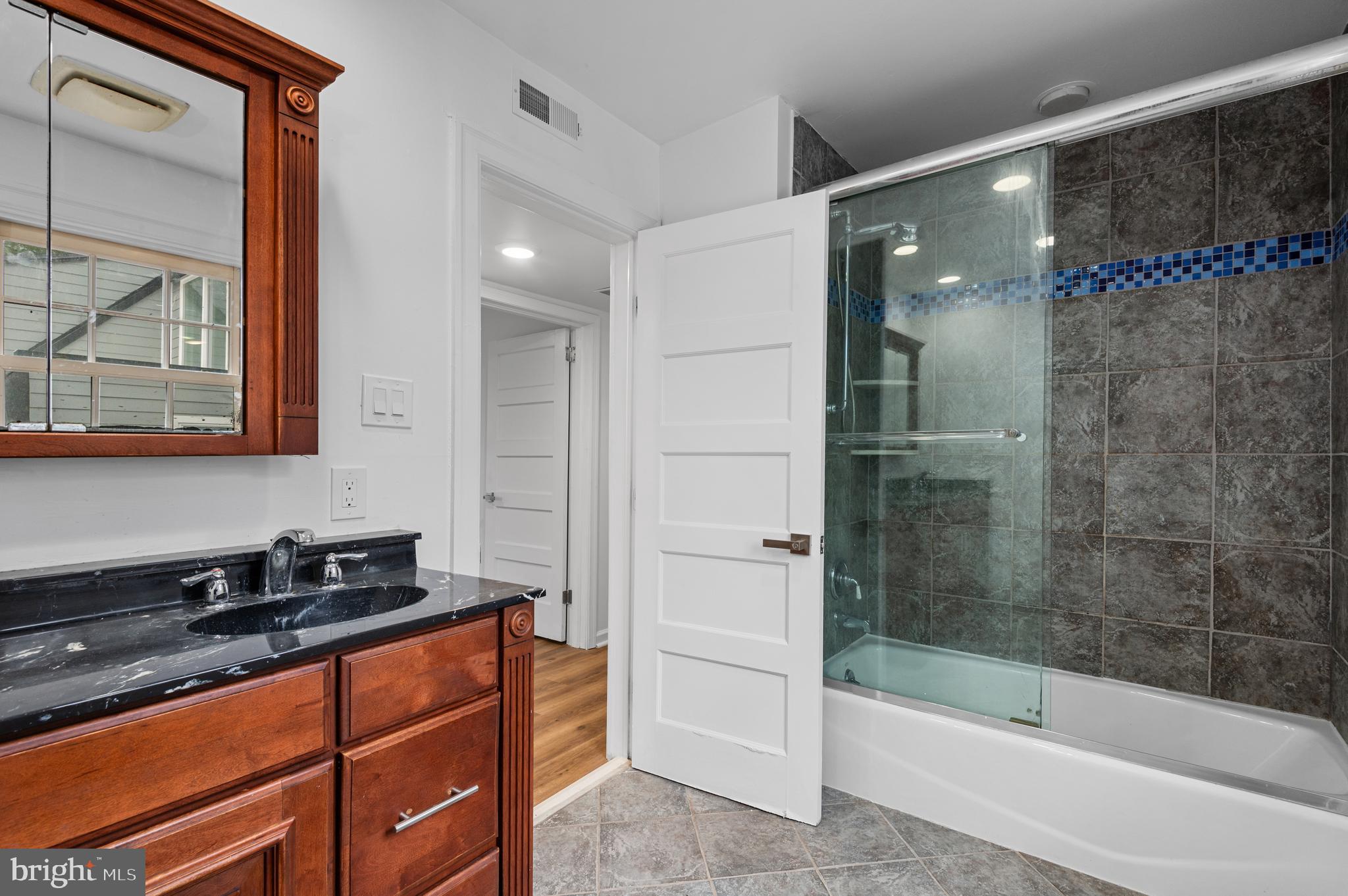 162 Union Avenue Bala Cynwyd, PA 19004 - Photo 3 of 11 a bathroom with a bathtub a sink and a shower