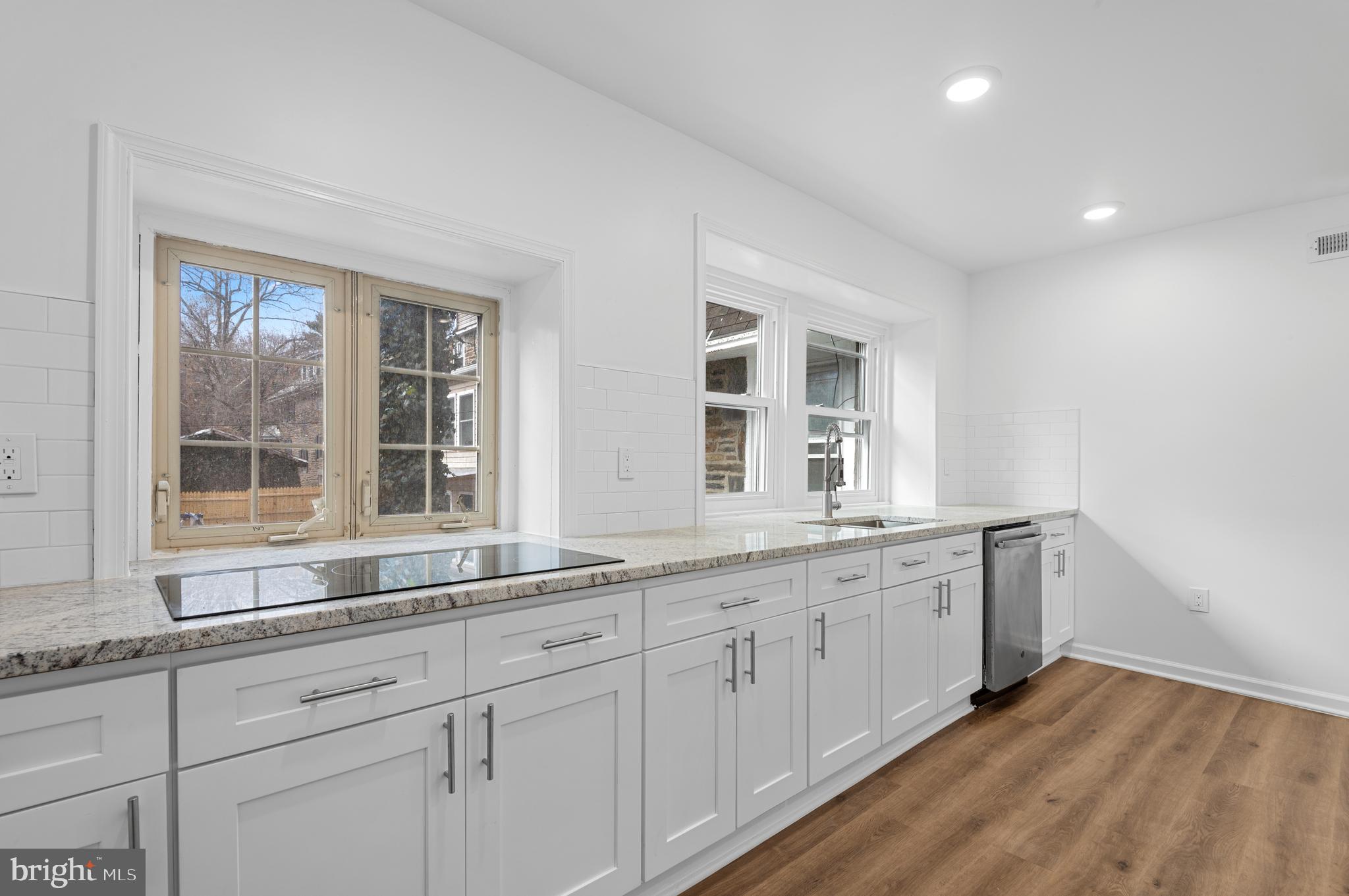 162 Union Avenue Bala Cynwyd, PA 19004 - Photo 5 of 11 a kitchen with granite countertop white cabinets and sink
