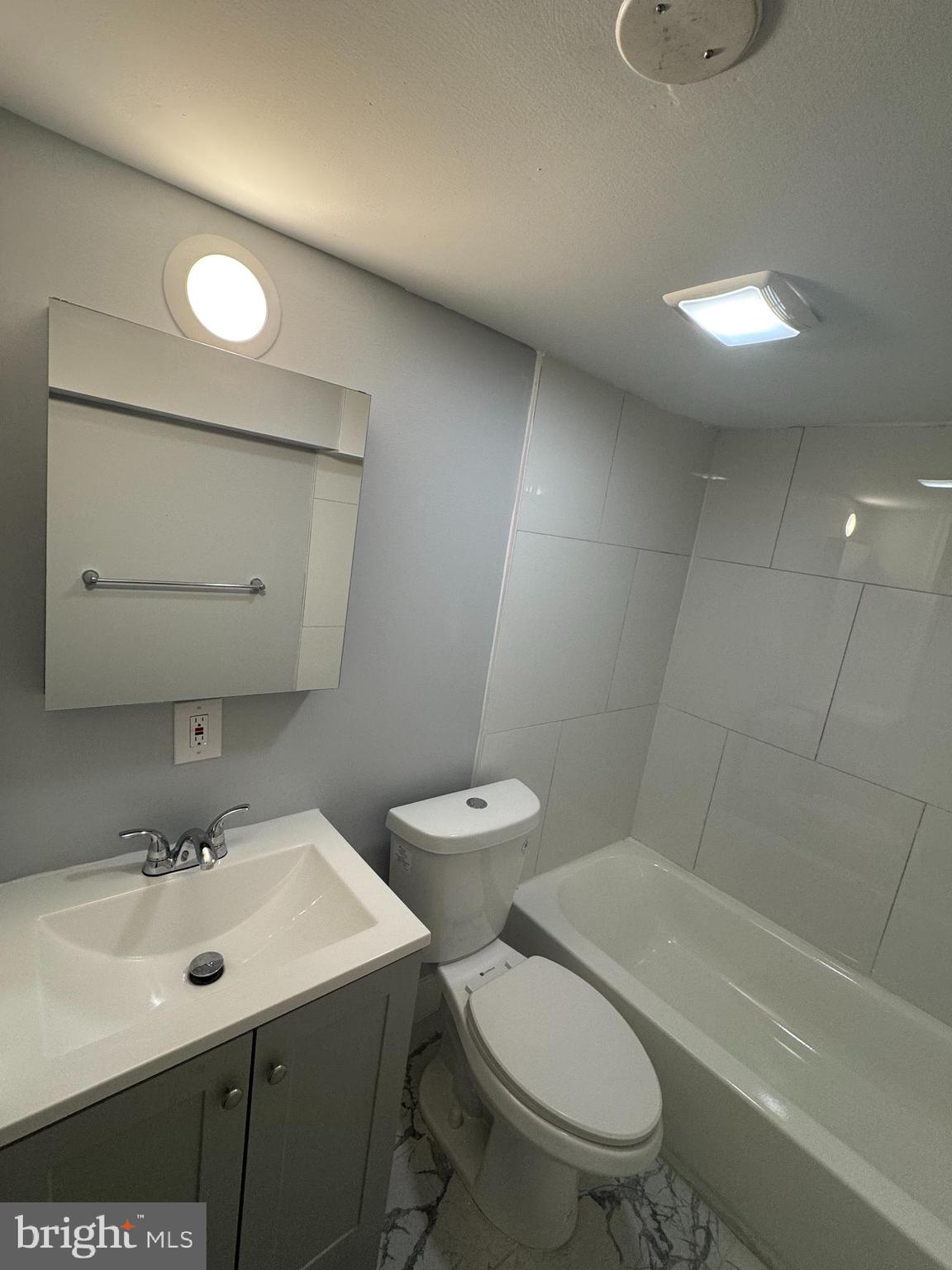 162 Union Avenue Bala Cynwyd, PA 19004 - Photo 9 of 11 a bathroom with a toilet a sink and mirror