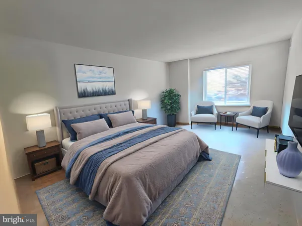 a bedroom with bed and a couch