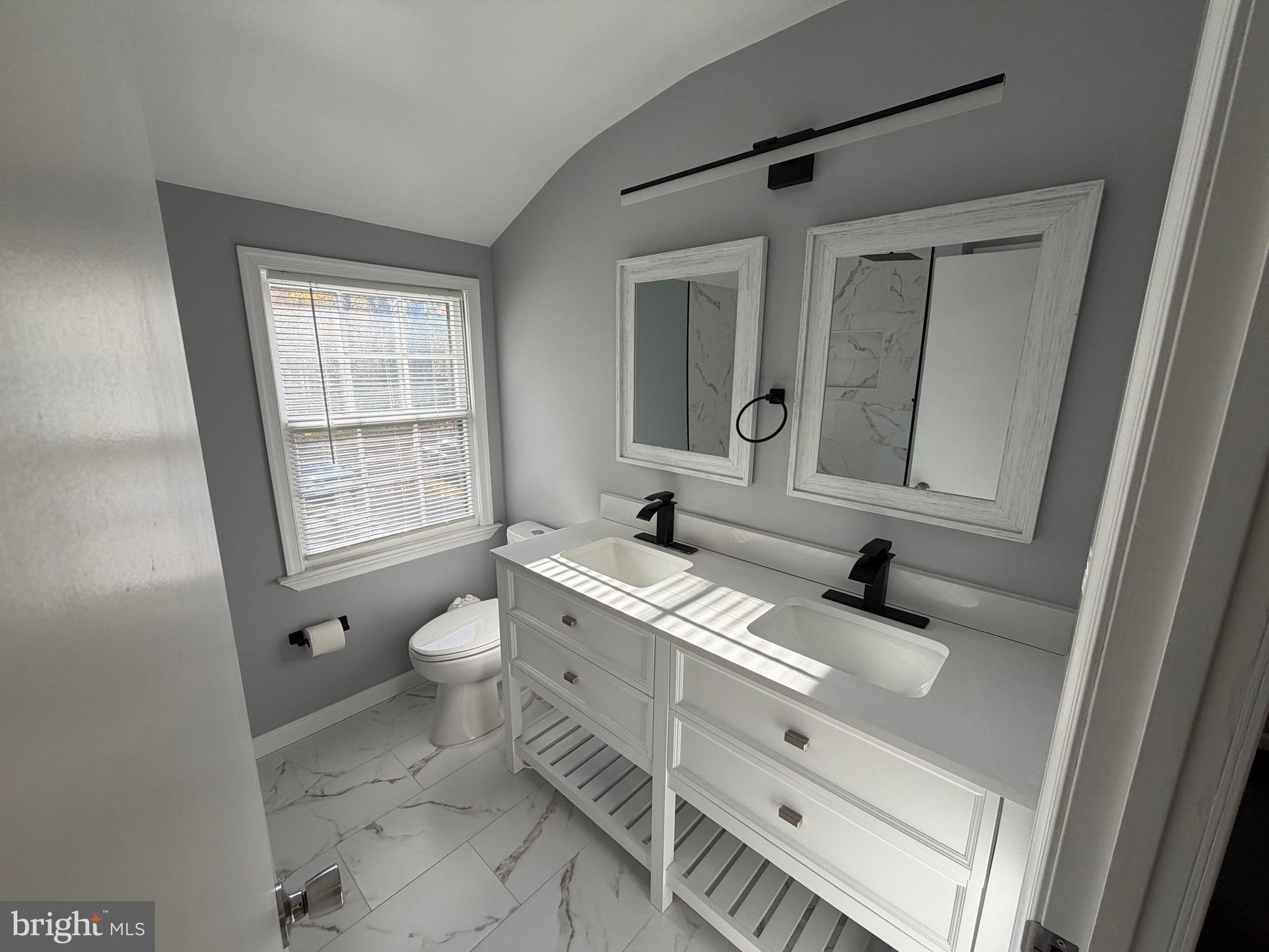 687 Bristol Road Southampton, PA 18966 - Photo 14 of 22 a bathroom with a sink a toilet and mirror