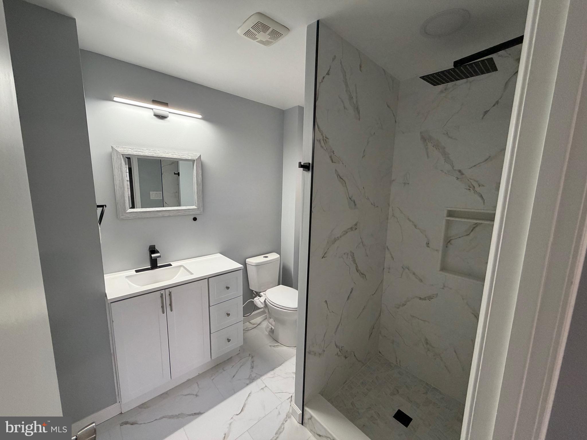 687 Bristol Road Southampton, PA 18966 - Photo 9 of 22 a bathroom with a shower sink mirror and toilet