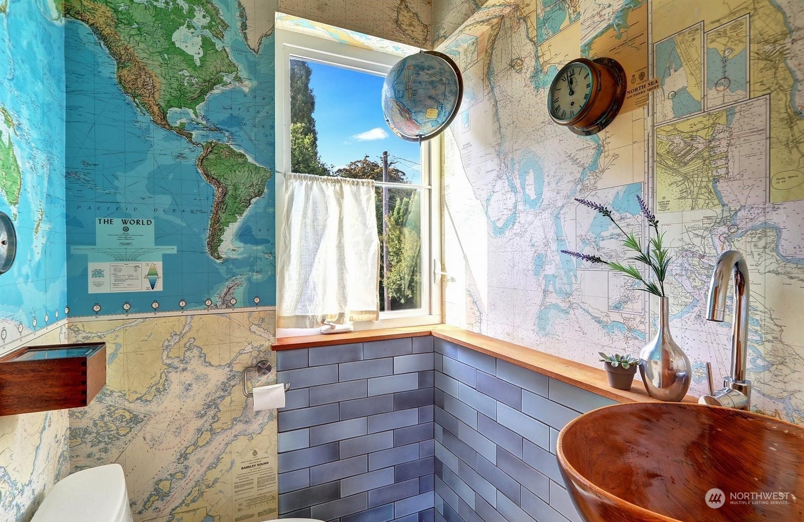 4606 Whitman Avenue North Seattle, WA 98103 - Photo 13 of 40 a bathroom with a sink and a mirror