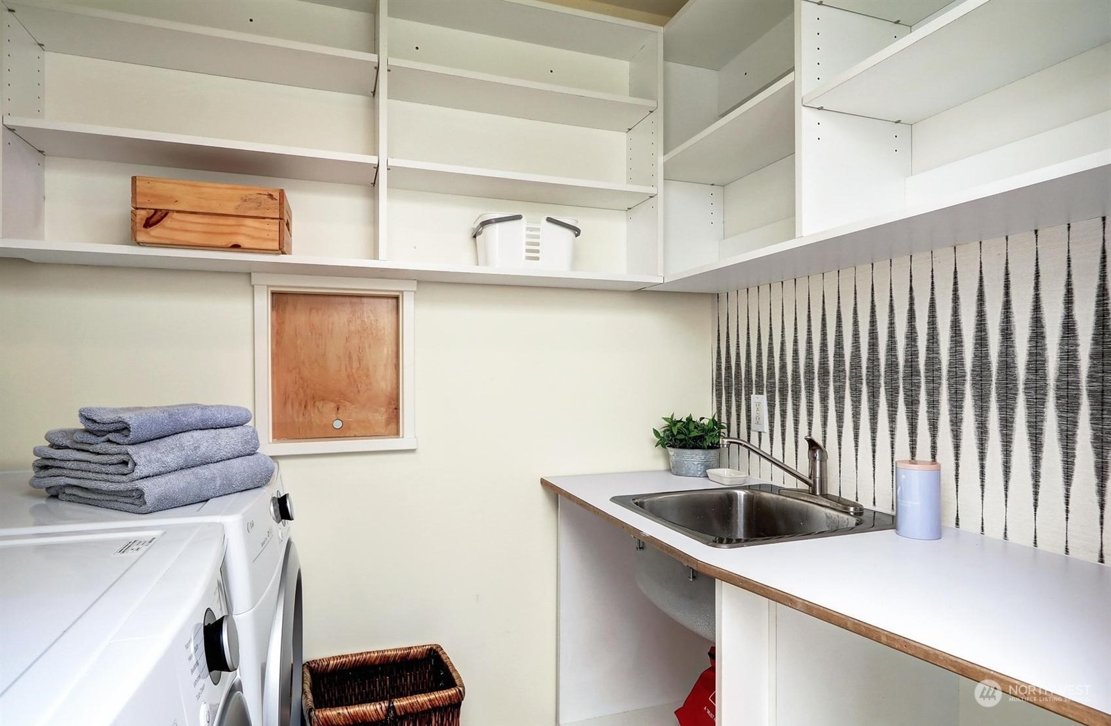 4606 Whitman Avenue North Seattle, WA 98103 - Photo 19 of 40 a kitchen with a sink and a stove top oven