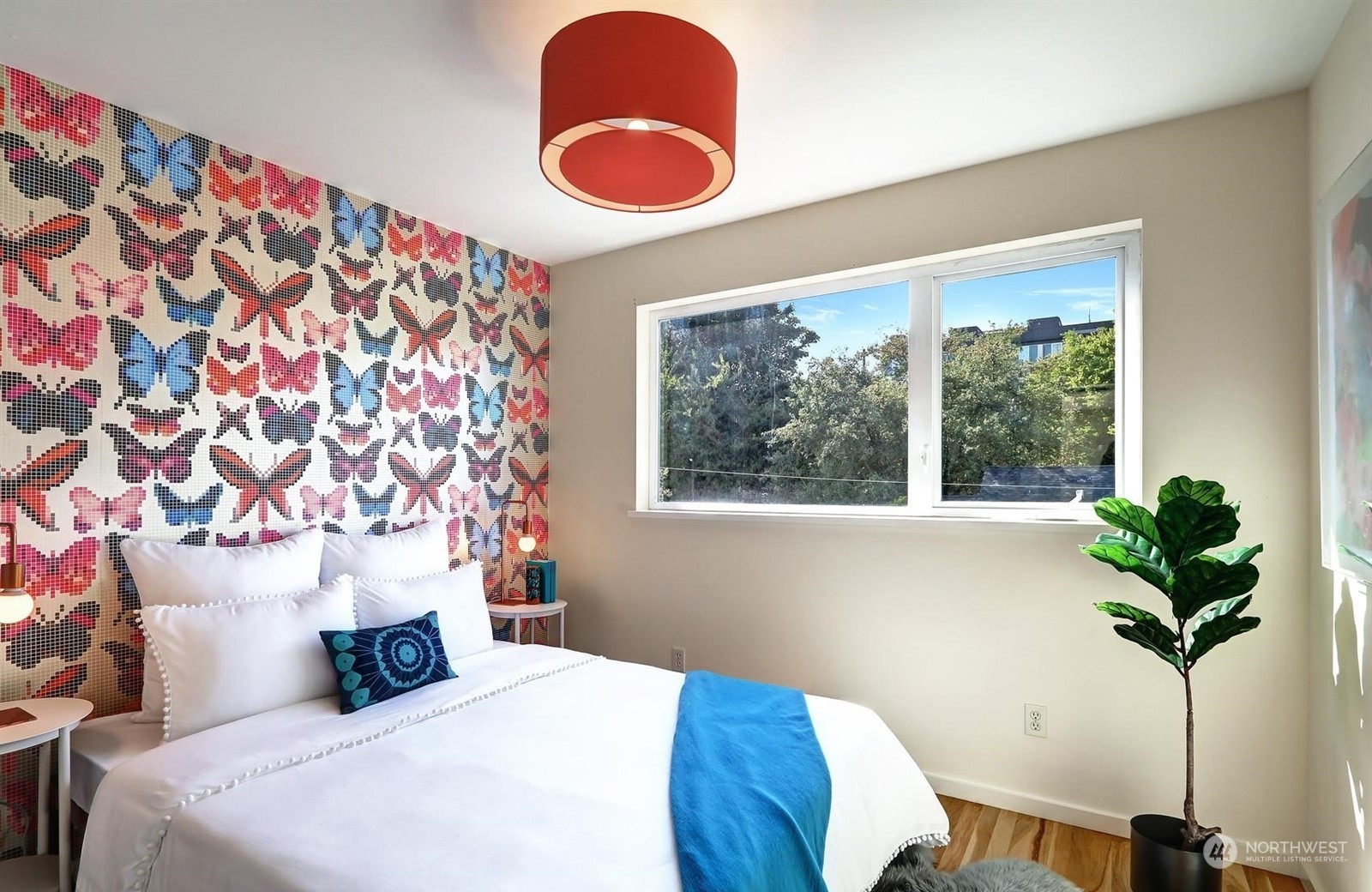 4606 Whitman Avenue North Seattle, WA 98103 - Photo 20 of 40 a bedroom with bed and a potted plant