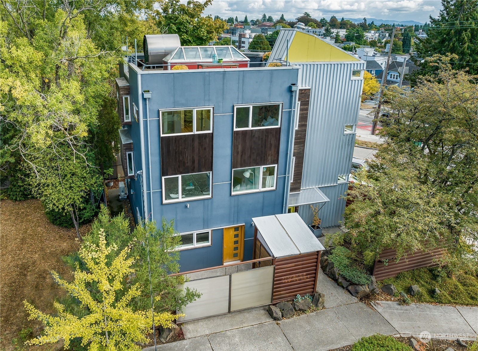 4606 Whitman Avenue North Seattle, WA 98103 - Photo 2 of 40 a front view of a house with a garden