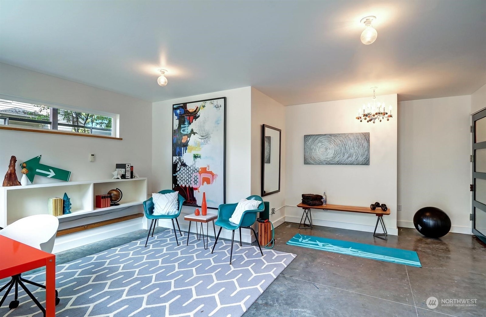 4606 Whitman Avenue North Seattle, WA 98103 - Photo 27 of 40 a living room with furniture and painting on the wall