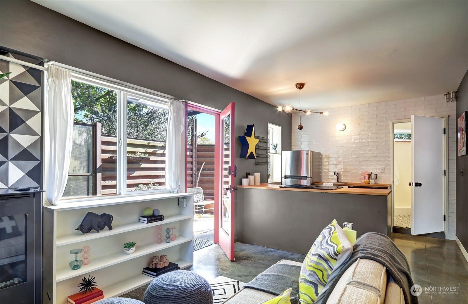 4606 Whitman Avenue North Seattle, WA 98103 - Photo 29 of 40 a living room filled with furniture and a large window