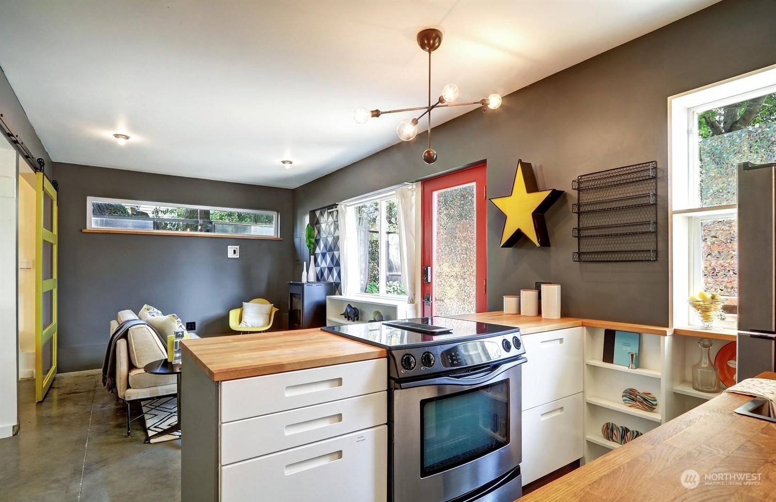 4606 Whitman Avenue North Seattle, WA 98103 - Photo 31 of 40 a kitchen that has a sink and a stove