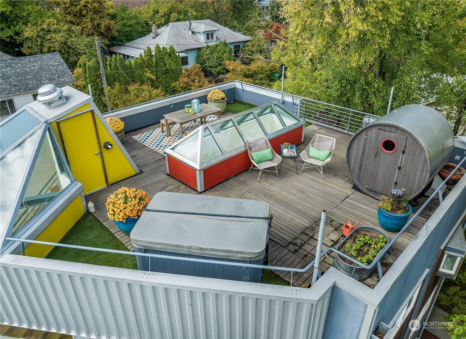 4606 Whitman Avenue North Seattle, WA 98103 - Photo 33 of 40 an outdoor sitting area with chairs