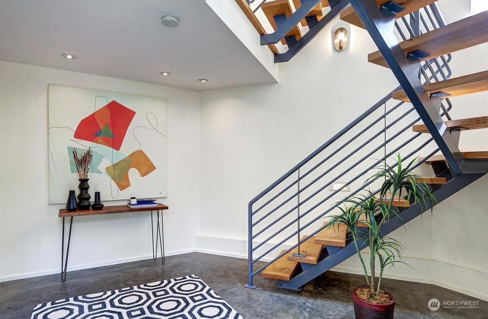 4606 Whitman Avenue North Seattle, WA 98103 - Photo 5 of 40 a bedroom with a bed and cabinets
