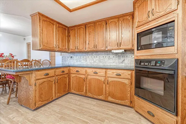 a kitchen with a stove and a microwave