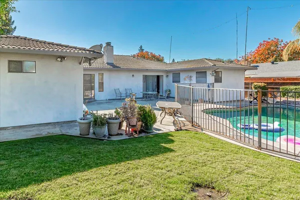 a view of a swimming pool with a patio