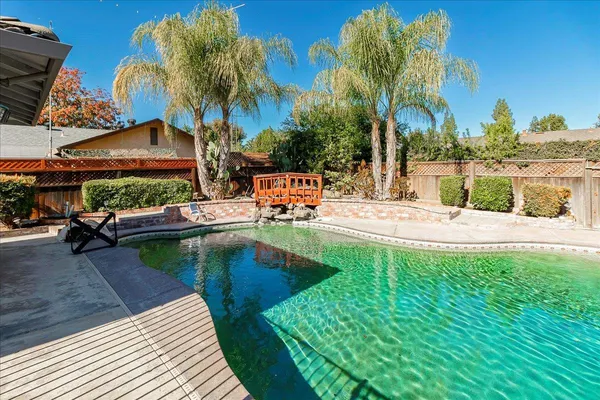 a view of swimming pool with chairs