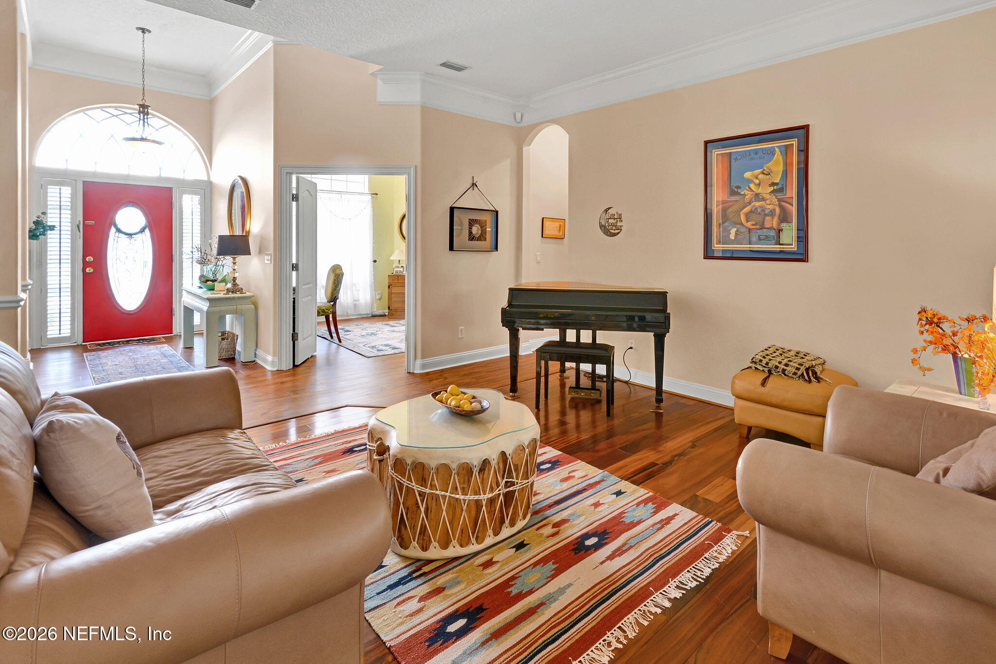 5950 West Shores Road Orange Park, FL 32003 - Photo 3 of 42 a living room with furniture a rug and a chandelier