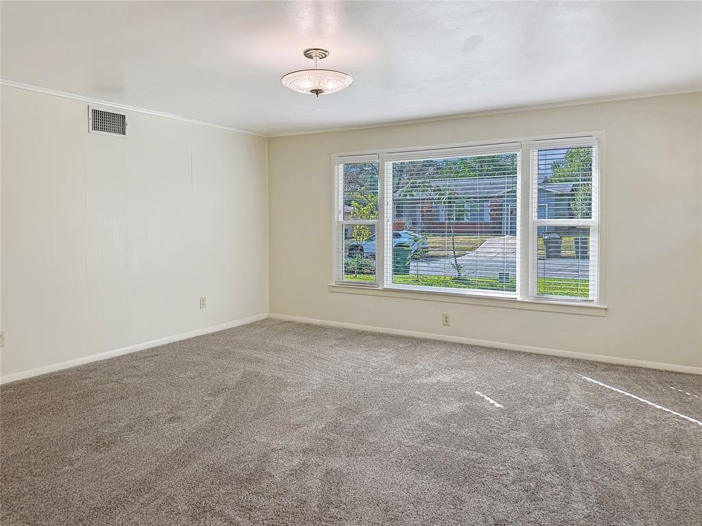 6713 Norma Street Fort Worth, TX 76112 - Photo 13 of 21 an empty room with a window