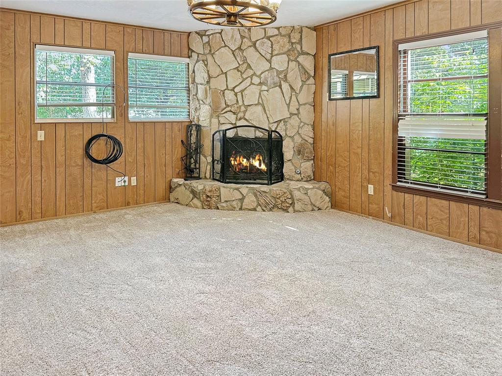 6713 Norma Street Fort Worth, TX 76112 - Photo 3 of 21 a view of a livingroom with a fireplace and a window