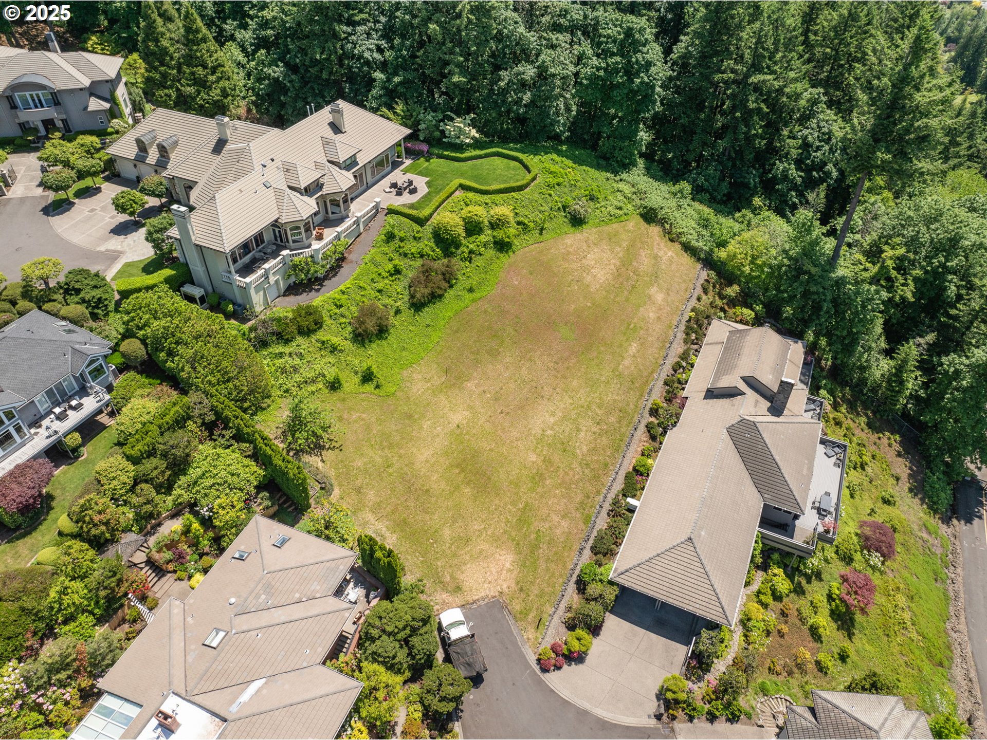 Ascot Court Portland, OR 97225 - Photo 3 of 12 an aerial view of a house with a yard and trees