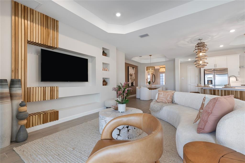 7157 Inlet Isles Lakewood Ranch, FL 34202 - Photo 12 of 26 a living room with furniture and a flat screen tv