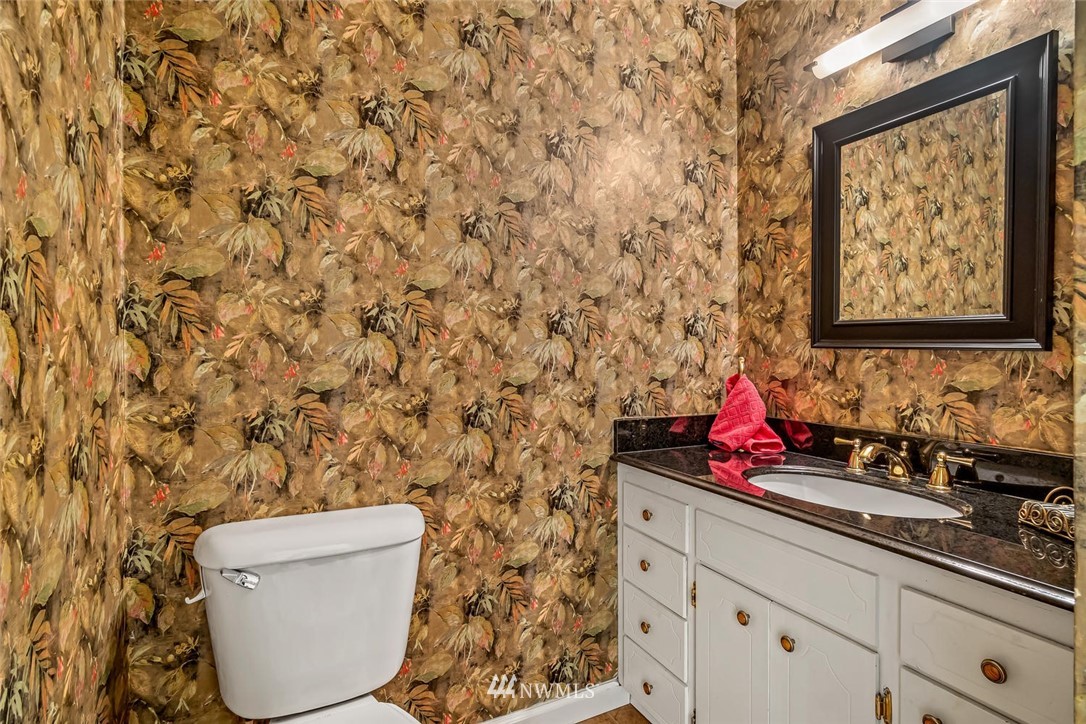 11812 Northeast 157th Street Bothell, WA 98011 - Photo 13 of 25 a bathroom with a toilet and a sink
