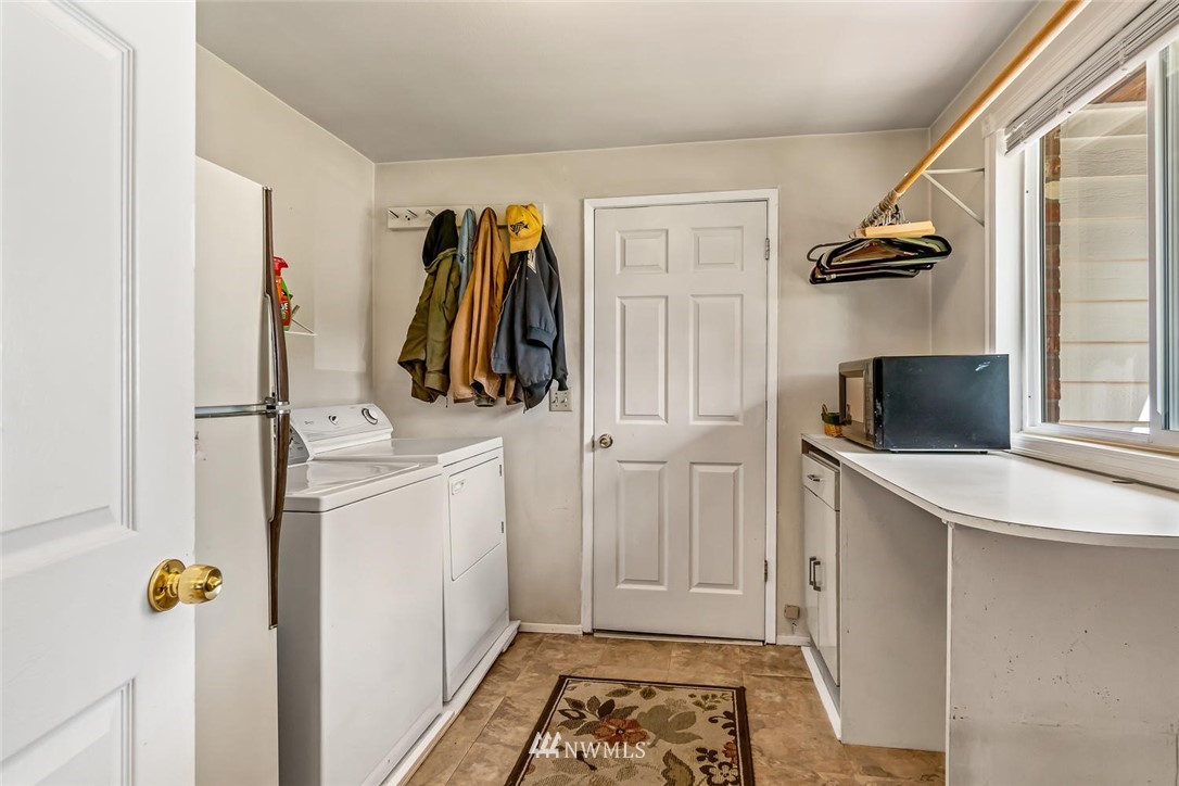 11812 Northeast 157th Street Bothell, WA 98011 - Photo 14 of 25 a storage room with wooden floor and furniture