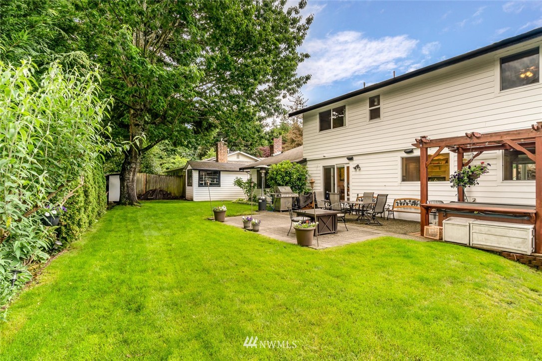 11812 Northeast 157th Street Bothell, WA 98011 - Photo 22 of 25 a view of a house with backyard and sitting area