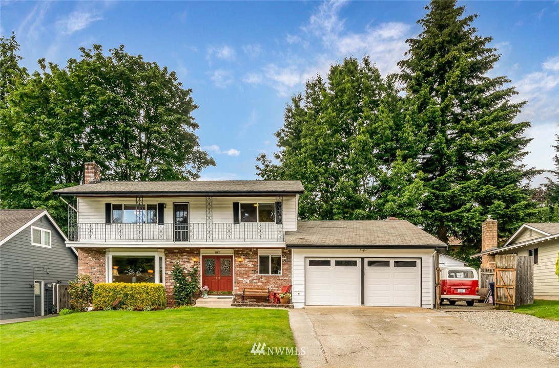 11812 Northeast 157th Street Bothell, WA 98011 - Photo 23 of 25 a front view of a house with garden