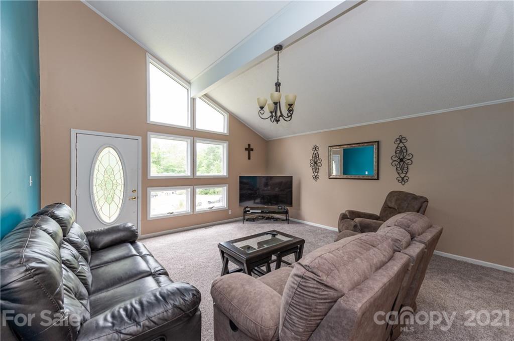 2026 State Rd S-29-726 Lancaster, SC 29720 - Photo 24 of 29 a living room with furniture a flat screen tv and a large window