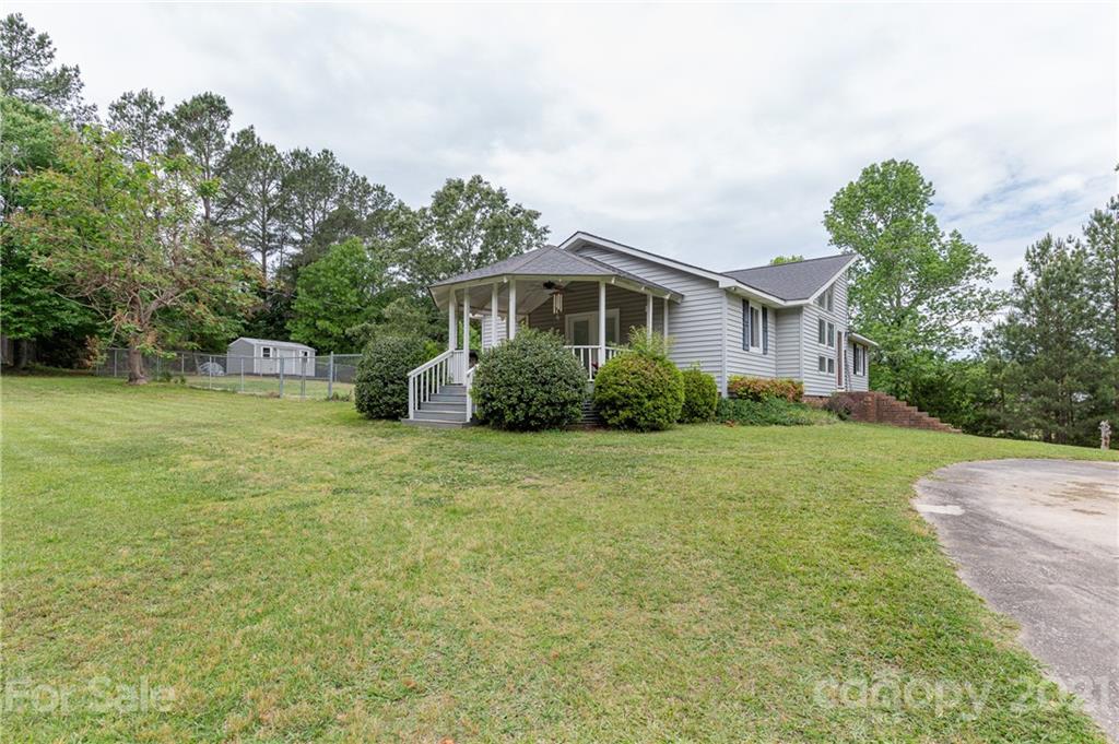 2026 State Rd S-29-726 Lancaster, SC 29720 - Photo 5 of 29 a front view of a house with garden