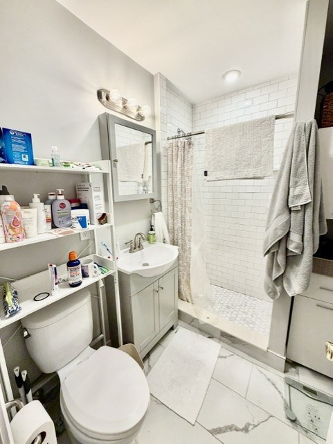 14 Cleveland Place, Unit 3 Boston, MA 02113 - Photo 19 of 22 a bathroom with a sink a toilet and shower