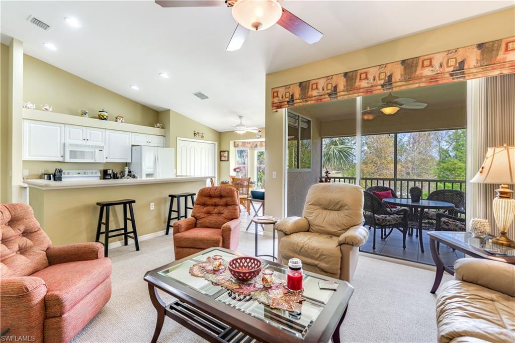 21341 Lancaster Run, Unit 425 Estero, FL 33928 - Photo 12 of 25 a living room with furniture and a large window