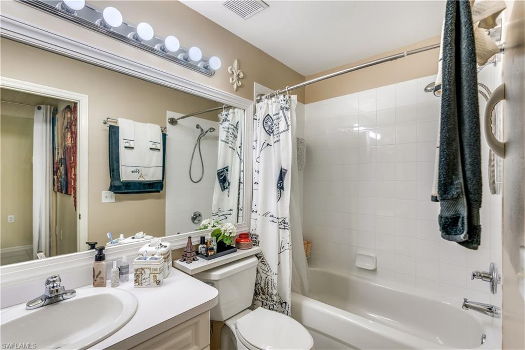 21341 Lancaster Run, Unit 425 Estero, FL 33928 - Photo 19 of 25 a bathroom with a bathtub shower sink and toilet