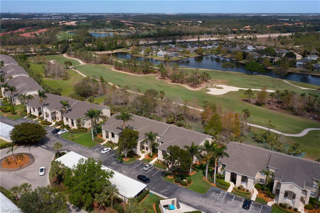 21341 Lancaster Run, Unit 425 Estero, FL 33928 - Photo 21 of 25 an aerial view of lake residential houses with outdoor space and lake view