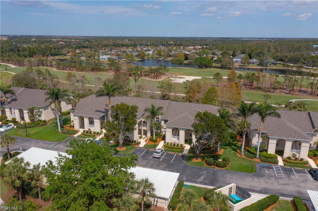 21341 Lancaster Run, Unit 425 Estero, FL 33928 - Photo 24 of 25 an aerial view of a house with a lake view