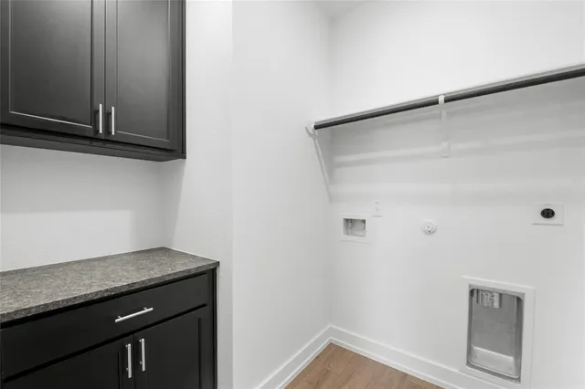 a view of a storage and utility room with closet