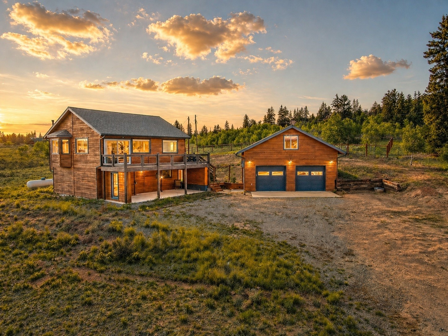 2491 Stagestop Road Jefferson, CO 80456 - Photo 1 of 43 a view of a big house with a big yard and large trees