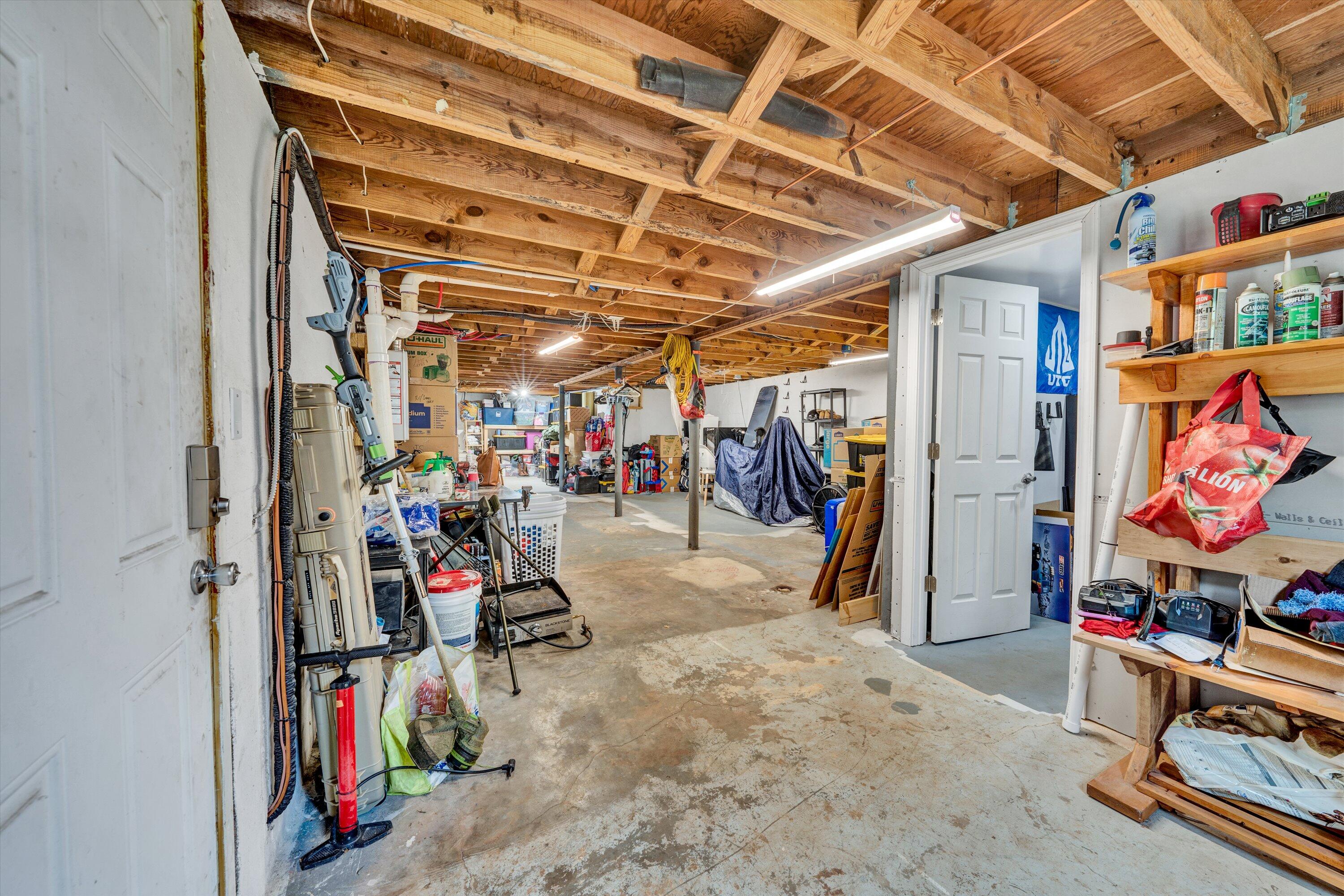 1200 Rock Spring Road Goodview, VA 24095 - Photo 22 of 31 a view of a storage room with a lot of stuff