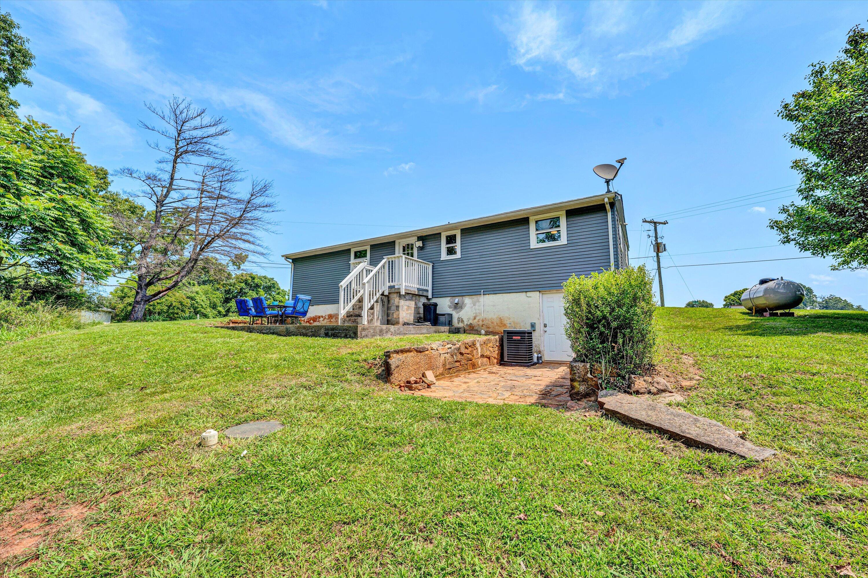 1200 Rock Spring Road Goodview, VA 24095 - Photo 27 of 31 a view of a house with backyard and sitting area